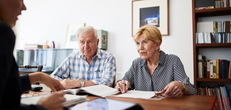 Senior-couple-meeting-with-financial-consultant-at-home.jpg